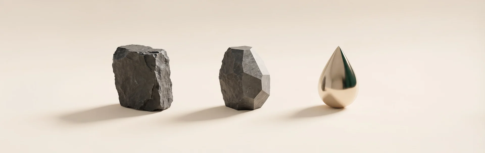A rough stone, a faceted stone and a polished gold drop, used as a metaphor for transformation
